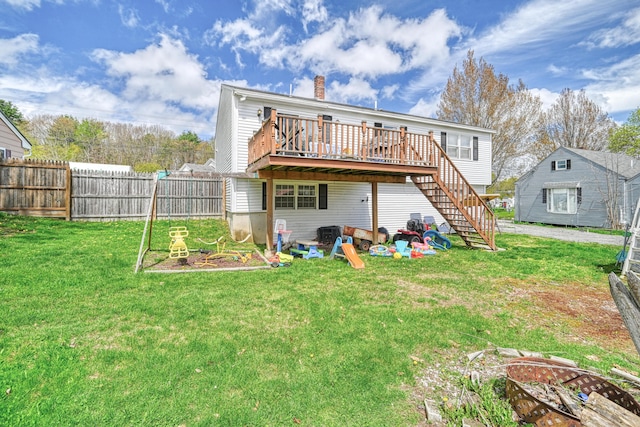 rear view of property with a wooden deck, a chimney, and stairway