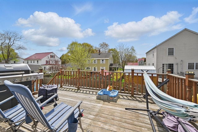 wooden deck with a residential view