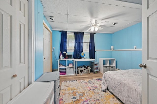 bedroom with wood finished floors and a ceiling fan