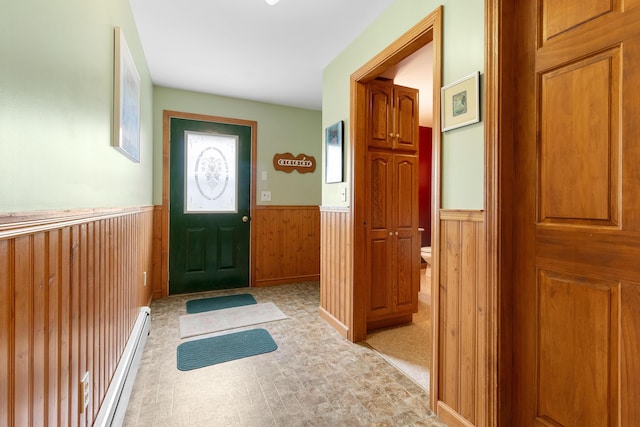 289 W Washington Rd, Washington, ME 04574 - foyer with a wainscoted wall, baseboard heating, wood walls, and light floors