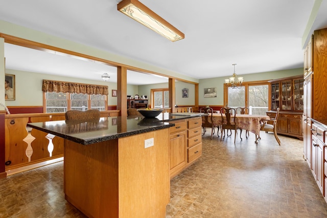 289 W Washington Rd, Washington, ME 04574 - kitchen with healthy amount of natural light, a chandelier, a wainscoted wall, a kitchen island, and hanging light fixtures