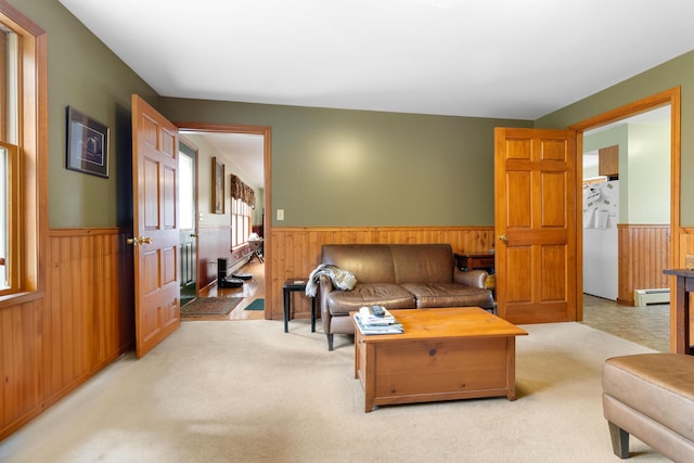 289 W Washington Rd, Washington, ME 04574 - living area with wainscoting, wooden walls, and baseboard heating