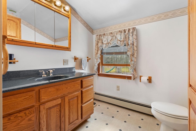 289 W Washington Rd, Washington, ME 04574 - bathroom featuring baseboard heating, toilet, and vanity