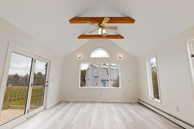 spare room featuring a baseboard heating unit, light wood finished floors, ceiling fan, and baseboards