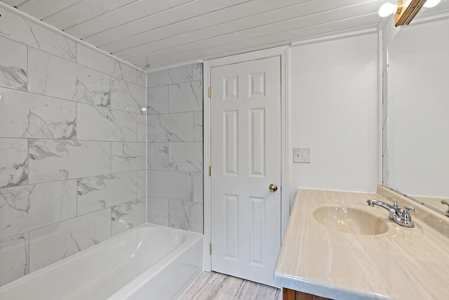 bathroom with wood finished floors, vanity, shower / bath combination, and wooden ceiling