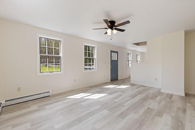 unfurnished living room with a ceiling fan, light wood-style floors, a baseboard heating unit, and baseboards