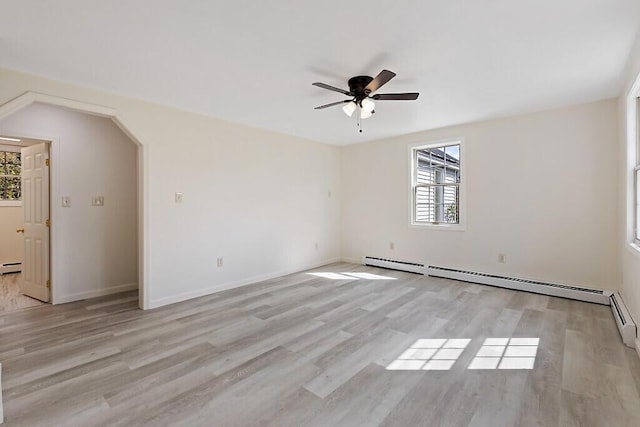 unfurnished room with light wood-style floors, ceiling fan, baseboards, and a baseboard radiator