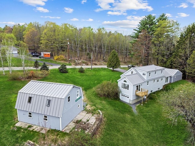 view of subject property with a forest