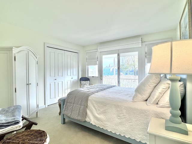 54 Village Way Unit 54, Rockport, ME 04856 - bedroom featuring access to exterior, light colored carpet, a closet, and baseboards