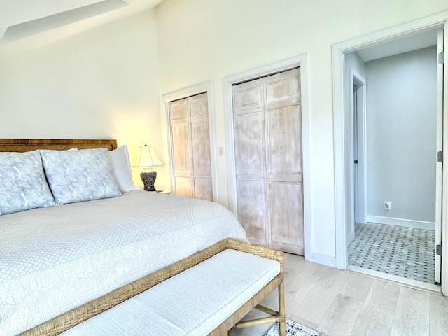 54 Village Way Unit 54, Rockport, ME 04856 - bedroom with light wood-type flooring, multiple closets, and baseboards
