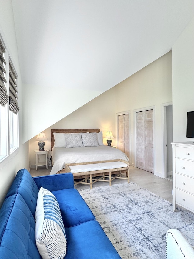54 Village Way Unit 54, Rockport, ME 04856 - bedroom with high vaulted ceiling, baseboards, and multiple closets