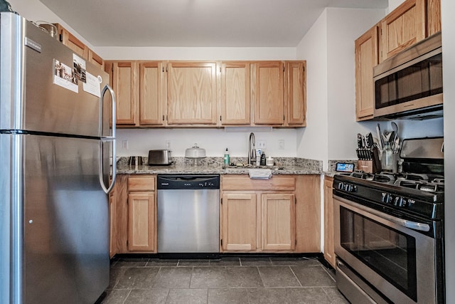 79 Bramhall St, Portland, ME 04102 - kitchen featuring stainless steel appliances, a sink, light stone counters, and light brown cabinets
