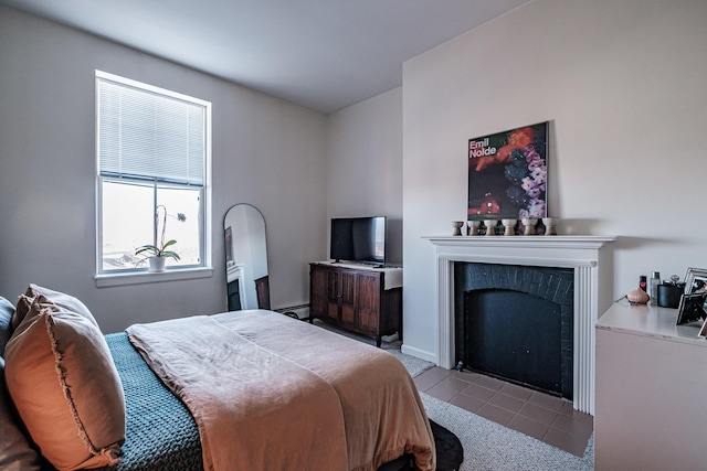 79 Bramhall St, Portland, ME 04102 - tiled bedroom with a fireplace with flush hearth and baseboard heating