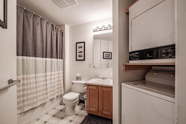 79 Bramhall St, Portland, ME 04102 - full bathroom featuring stacked washer and clothes dryer, toilet, vanity, tile patterned floors, and shower / bath combination with curtain