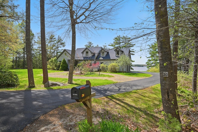 20 Eagle Point Rd, Bath, ME 04530 - cape cod-style house featuring a front yard and asphalt driveway