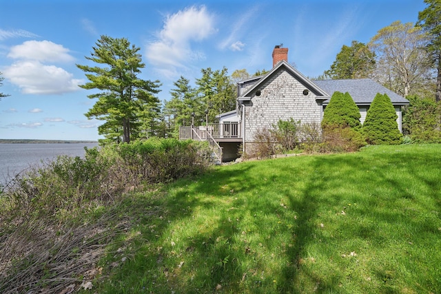 20 Eagle Point Rd, Bath, ME 04530 - view of side of home featuring a chimney, a yard, and a wooden deck