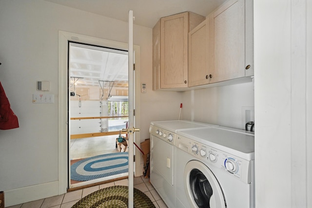 20 Eagle Point Rd, Bath, ME 04530 - laundry area featuring cabinet space, independent washer and dryer, and light tile patterned floors