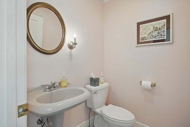 20 Eagle Point Rd, Bath, ME 04530 - half bath featuring baseboards, toilet, and a sink