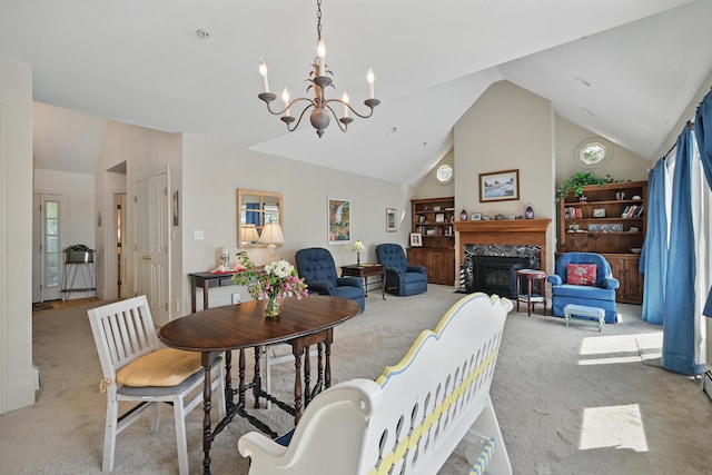 20 Eagle Point Rd, Bath, ME 04530 - carpeted dining area featuring vaulted ceiling, a chandelier, and a high end fireplace