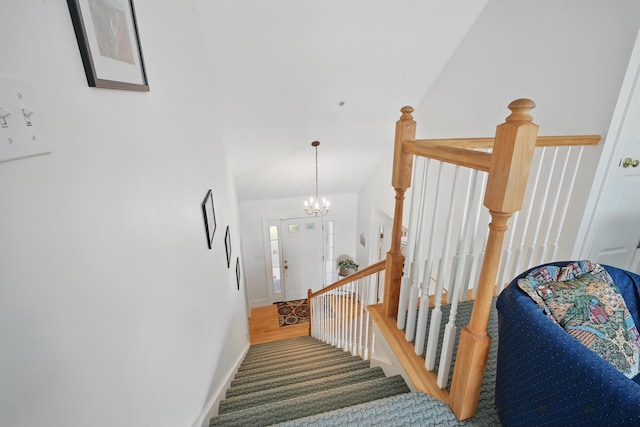 20 Eagle Point Rd, Bath, ME 04530 - stairs with vaulted ceiling, a chandelier, and baseboards