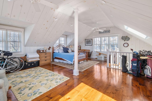 150 Webhannet Dr, Wells, ME 04090 - bedroom featuring wood-type flooring, lofted ceiling, multiple windows, and a skylight