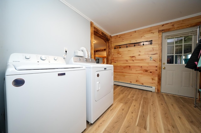 50 Beans Mill Rd, Corinth, ME 04427 - laundry area with a baseboard heating unit, independent washer and dryer, crown molding, light wood finished floors, and wood walls