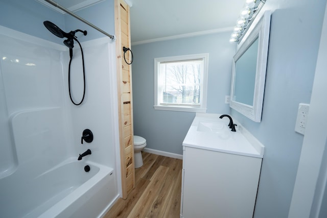 50 Beans Mill Rd, Corinth, ME 04427 - full bathroom with wood finished floors, toilet, crown molding, vanity, and bathtub / shower combination