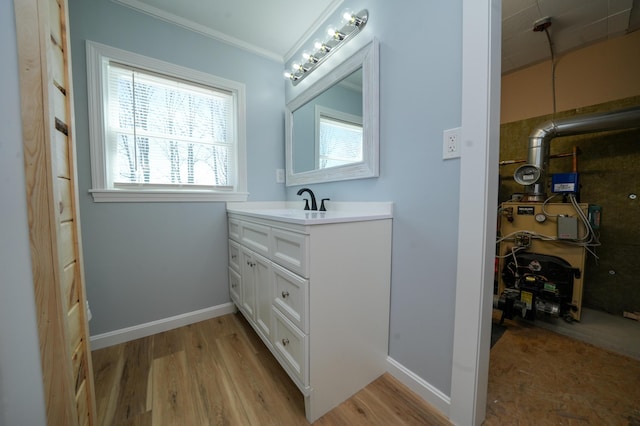 50 Beans Mill Rd, Corinth, ME 04427 - bathroom featuring ornamental molding, vanity, wood finished floors, and baseboards