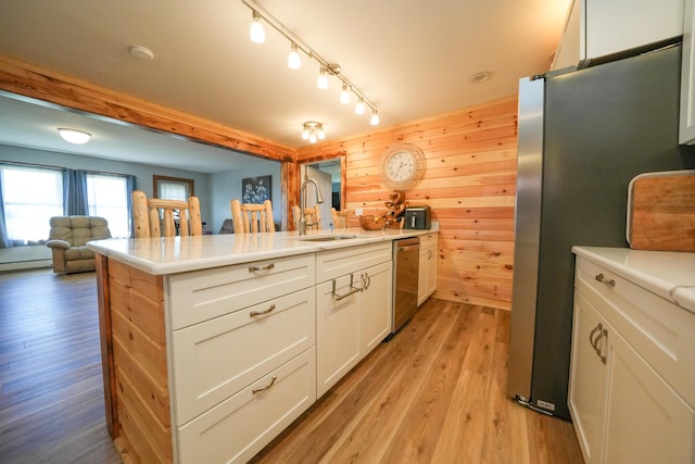 50 Beans Mill Rd, Corinth, ME 04427 - kitchen featuring a sink, appliances with stainless steel finishes, white cabinetry, light wood-style flooring, and light countertops