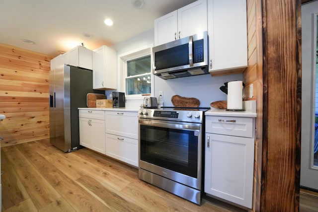 50 Beans Mill Rd, Corinth, ME 04427 - kitchen featuring appliances with stainless steel finishes, light wood-type flooring, light countertops, white cabinets, and recessed lighting