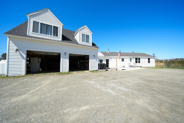 50 Beans Mill Rd, Corinth, ME 04427 - view of property exterior featuring roof with shingles