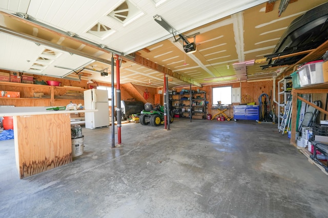 50 Beans Mill Rd, Corinth, ME 04427 - garage with freestanding refrigerator and a workshop area