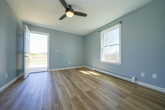 50 Beans Mill Rd, Corinth, ME 04427 - spare room with a baseboard heating unit, wood finished floors, ceiling fan, and baseboards