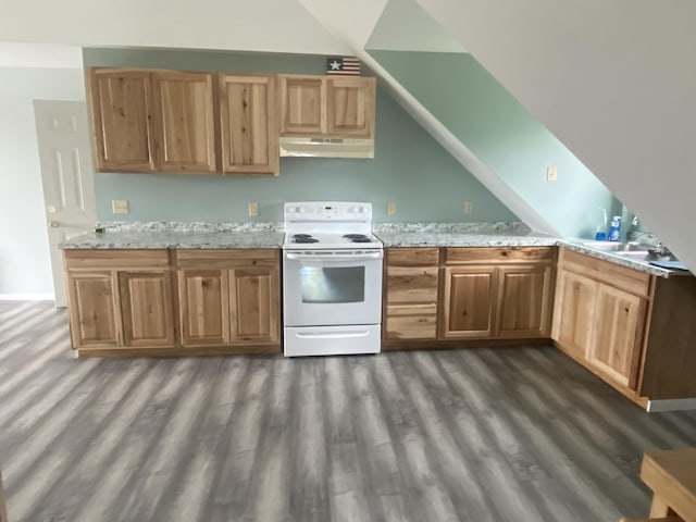 50 Beans Mill Rd, Corinth, ME 04427 - kitchen with white range with electric cooktop, under cabinet range hood, dark wood-type flooring, vaulted ceiling, and light stone counters