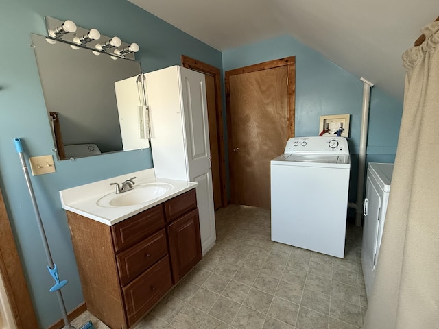 50 Beans Mill Rd, Corinth, ME 04427 - bathroom with washer / clothes dryer, vaulted ceiling, and vanity