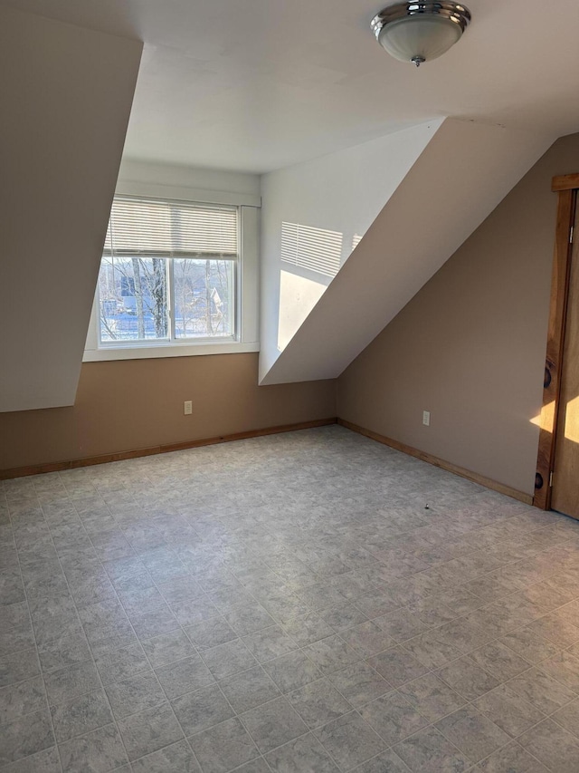 50 Beans Mill Rd, Corinth, ME 04427 - additional living space featuring vaulted ceiling and baseboards