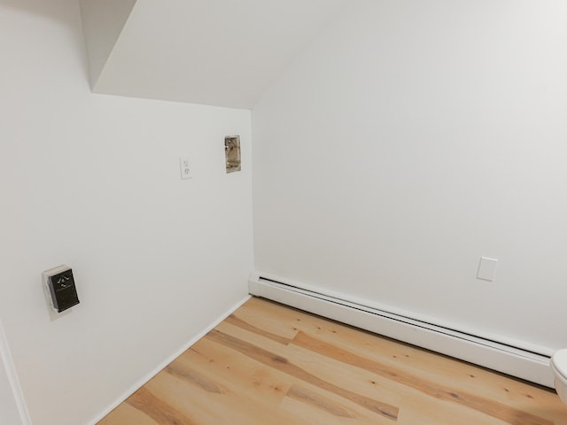 35 Mathews Ave Unit 8, Waterville, ME 04901 - washroom with a baseboard heating unit, wood finished floors, and baseboards