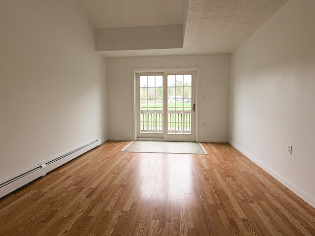 35 Mathews Ave Unit 8, Waterville, ME 04901 - spare room with a baseboard heating unit, light wood-style flooring, and baseboards