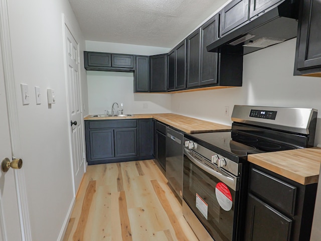 35 Mathews Ave Unit 8, Waterville, ME 04901 - kitchen with appliances with stainless steel finishes, wood counters, a sink, light wood finished floors, and under cabinet range hood