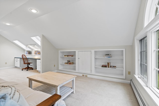 49 Dipper Cove Rd, Harpswell, ME 04066 - living area featuring baseboard heating, lofted ceiling, light carpet, built in features, and a skylight