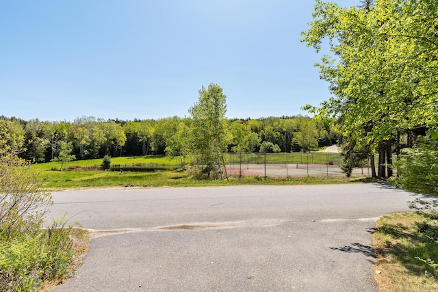 49 Dipper Cove Rd, Harpswell, ME 04066 - view of asphalt street featuring a forest view