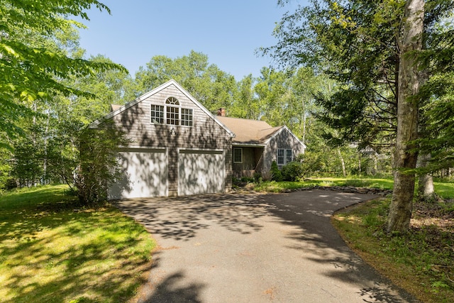 49 Dipper Cove Rd, Harpswell, ME 04066 - shingle-style home with asphalt driveway, a chimney, and a front lawn