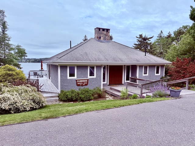 49 Dipper Cove Rd, Harpswell, ME 04066 - view of front of property with roof with shingles, a chimney, and a deck with water view