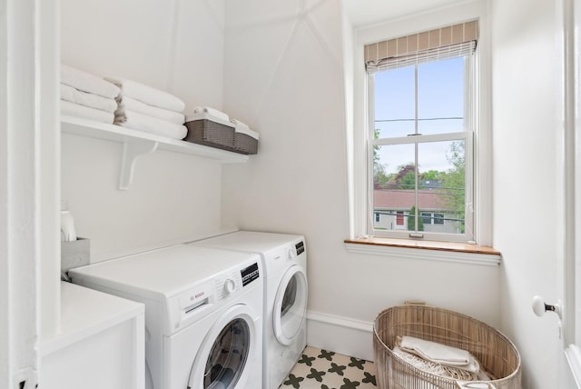 31 Mackworth St, Portland, ME 04103 - laundry area featuring washing machine and clothes dryer, baseboards, and tile patterned floors