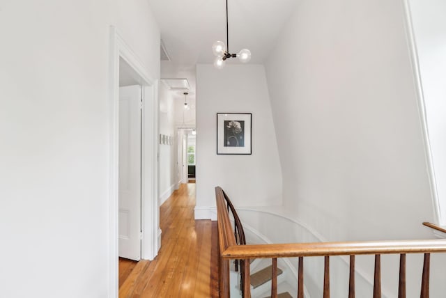 31 Mackworth St, Portland, ME 04103 - hallway with light wood finished floors and an upstairs landing