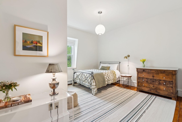 31 Mackworth St, Portland, ME 04103 - bedroom featuring wood finished floors, baseboards, and baseboard heating