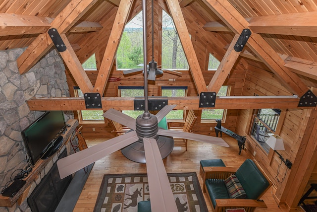 exercise room with wood ceiling, lofted ceiling, wooden walls, and hardwood / wood-style flooring