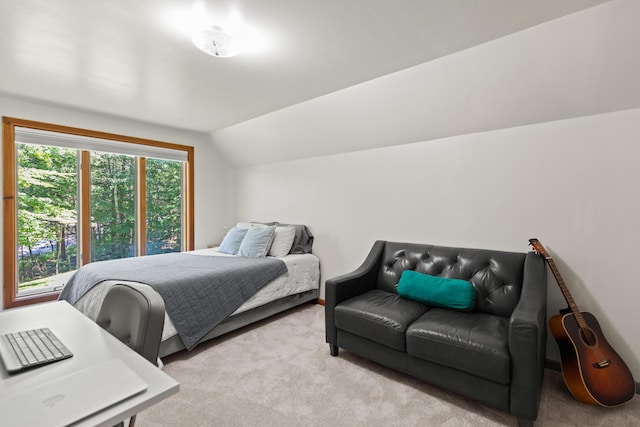 bedroom featuring carpet floors and lofted ceiling