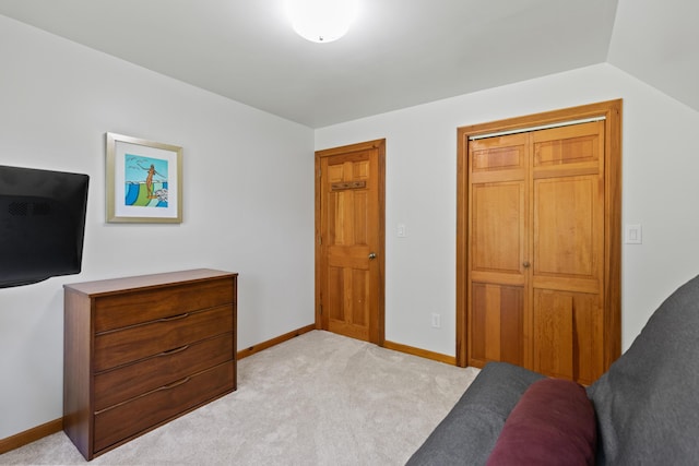 bedroom with carpet and baseboards