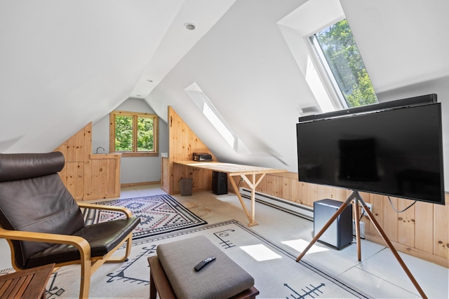 living area with a skylight, a baseboard radiator, vaulted ceiling, and wood walls